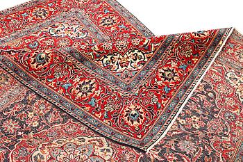 A Kashan carpet, a. 300 x 195 cm.