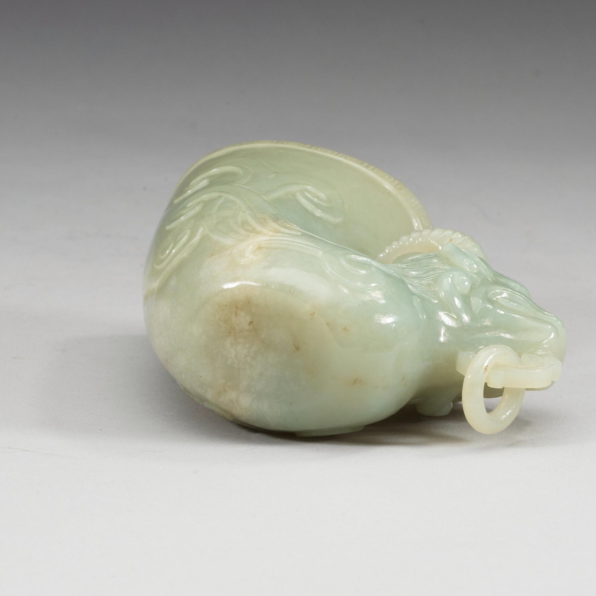 A Chinese carved nephrite rhyton beaker.