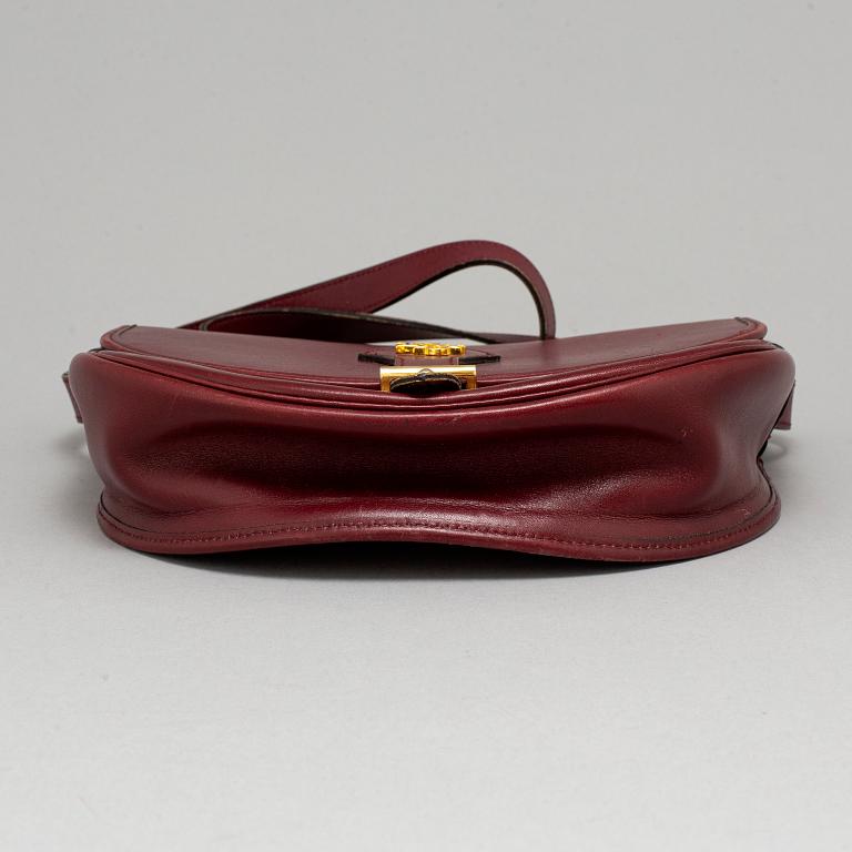 CHRISTIAN DIOR, a leather bag.