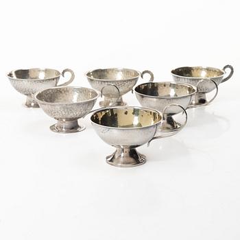 Gustaf Möllenborg, a silver bowl, Stockholm 1851, six silver punch cups, including CG Hallberg, and a silver spoon.