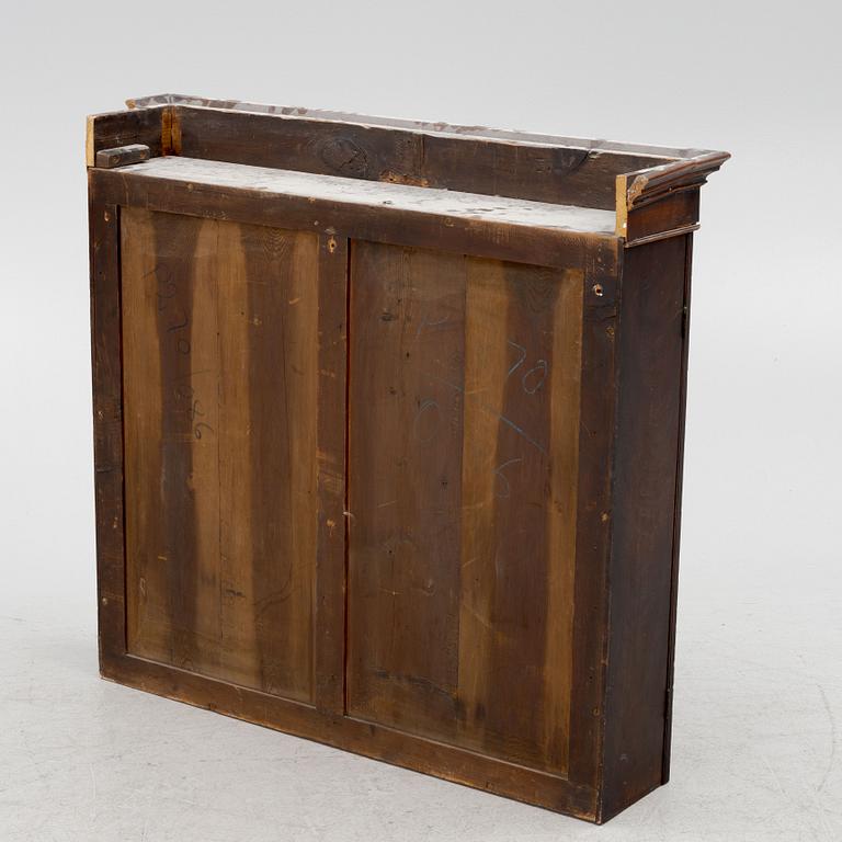 A mahogany veneered vitrine wal cabinet.