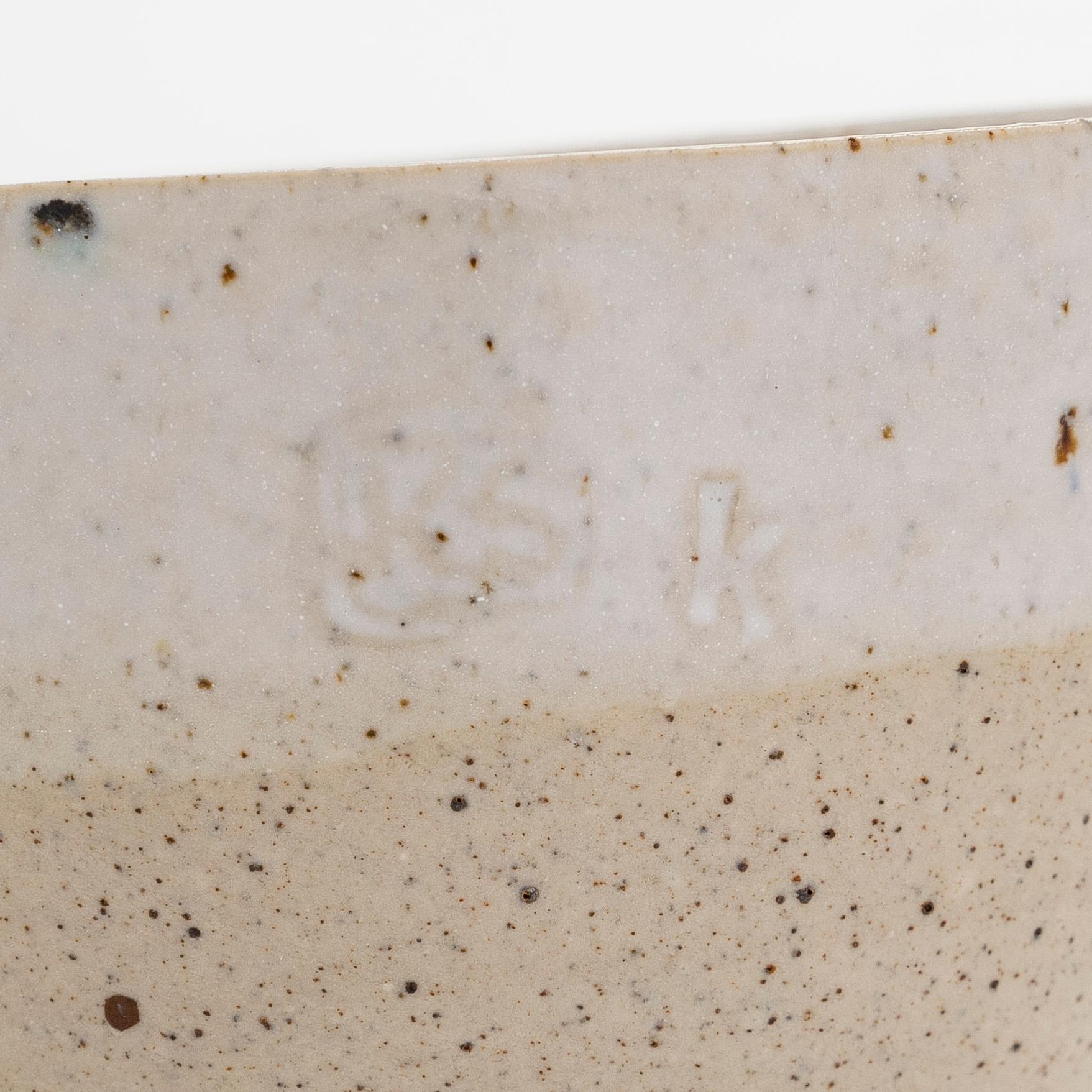 Kyllikki Salmenhaara, a stoneware tea strainer signed KS.