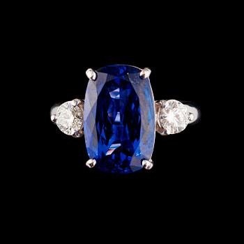 74. A tanzanite, 8.20 cts, and brilliant-cut diamond ring. Total carat weight of diamonds circa 0.58 ct.