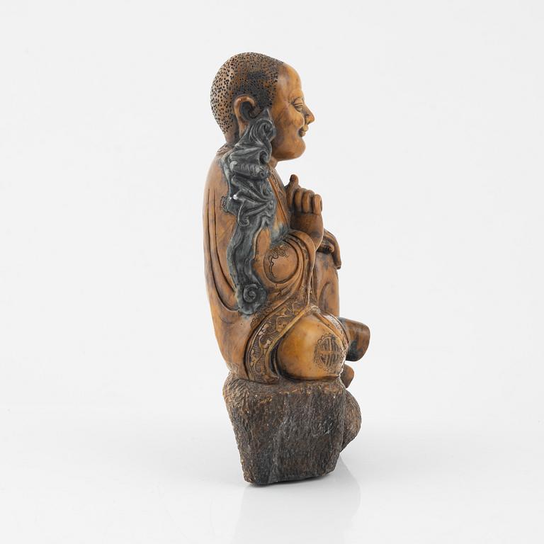 A soapstone sculpture of a lohan, late Qing dynasty.