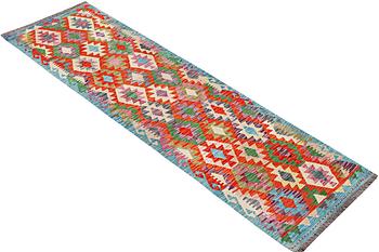 A runner carpet, Kilim, c. 290 x 81 cm.