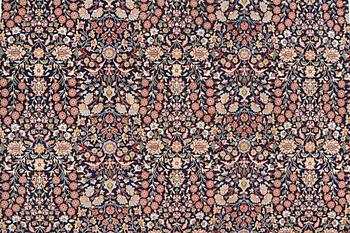 A signed Hereke carpet, ca 340 x 246 cm.