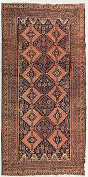 An antique Beludj carpet ca 227 x 122 cm.