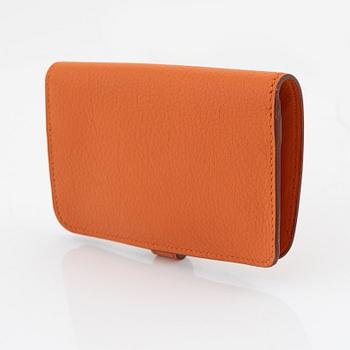 Hermès, a orange leather 'Dogon' wallet, 1998.