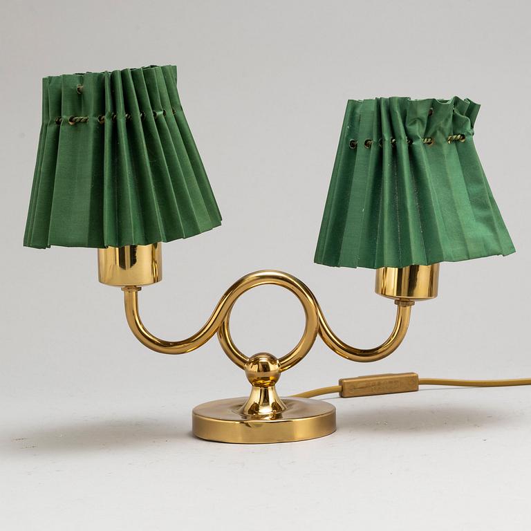 JOSEF FRANK, a brass table lamp for two lights, model 2483, Svenskt Tenn, provenance Estrid Ericson.