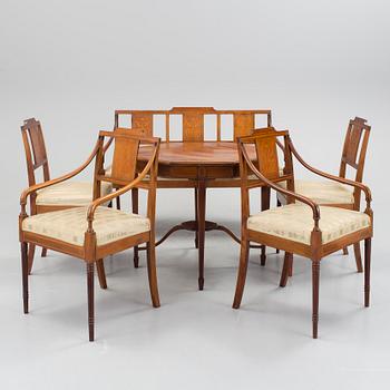 A 1920/30s Swedish Grace sofa, a pair of chairs, a pair of armchairs and a table veneered with mahogany.