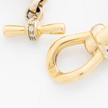 Armband 18K guld med vita stenar.