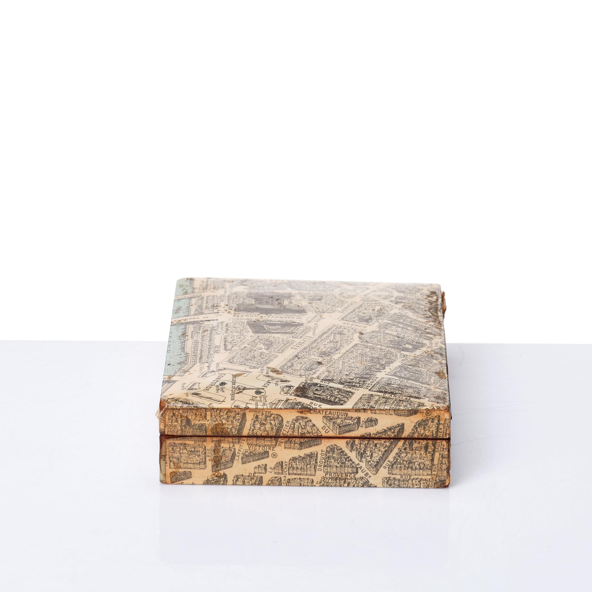 A mahogany cigarette box covered with a map over Paris, probably acquired Svenskt Tenn, Stockholm, ca 1940s.