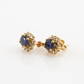 Earrings, a pair of 18K gold set with oval faceted sapphires and round brilliant-cut diamonds.