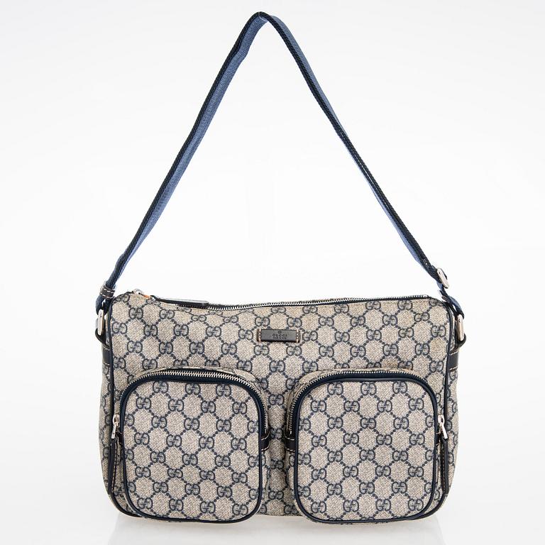 Gucci, A "GG Supreme messenger" bag.