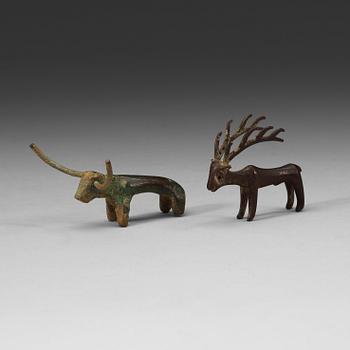 437. Two bronze figures in the shape of a bull and a stag, presumably Scythian, about 700 B.C. - 200 A.D.
