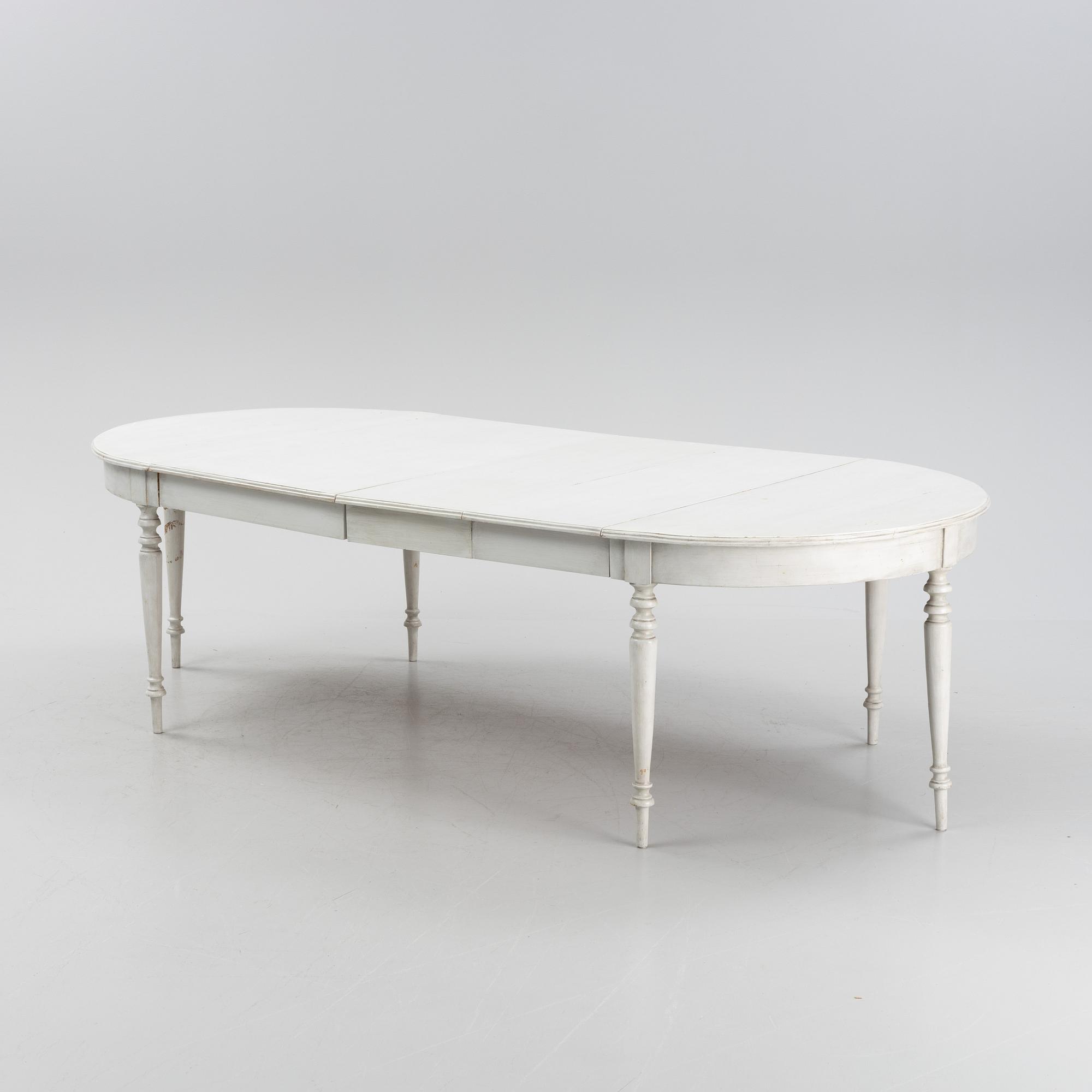 A painted dining table, 20th Century with older parts.