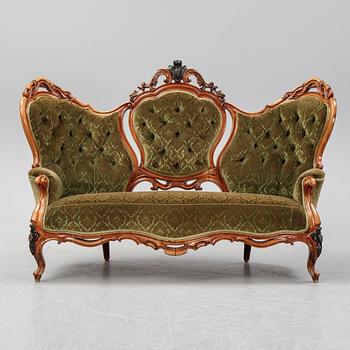 A rococo style sofa, four chairs and a table, second half of the 19th Century.