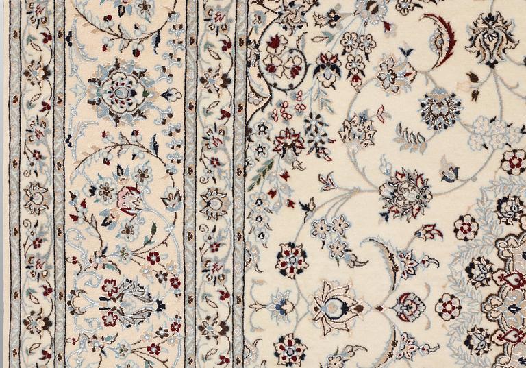 A Nain carpet, part silk, so called 6LAA, approximately 207 x 208 cm.