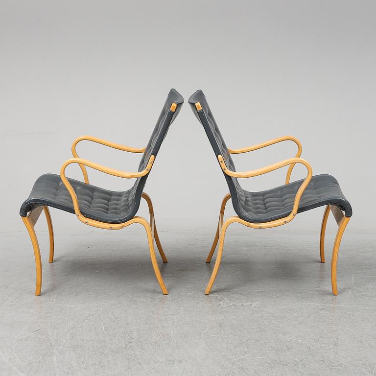 A second half of the 20th Century pair of 'Mina' armchairis by Bruno Mathsson for Mathsson International.