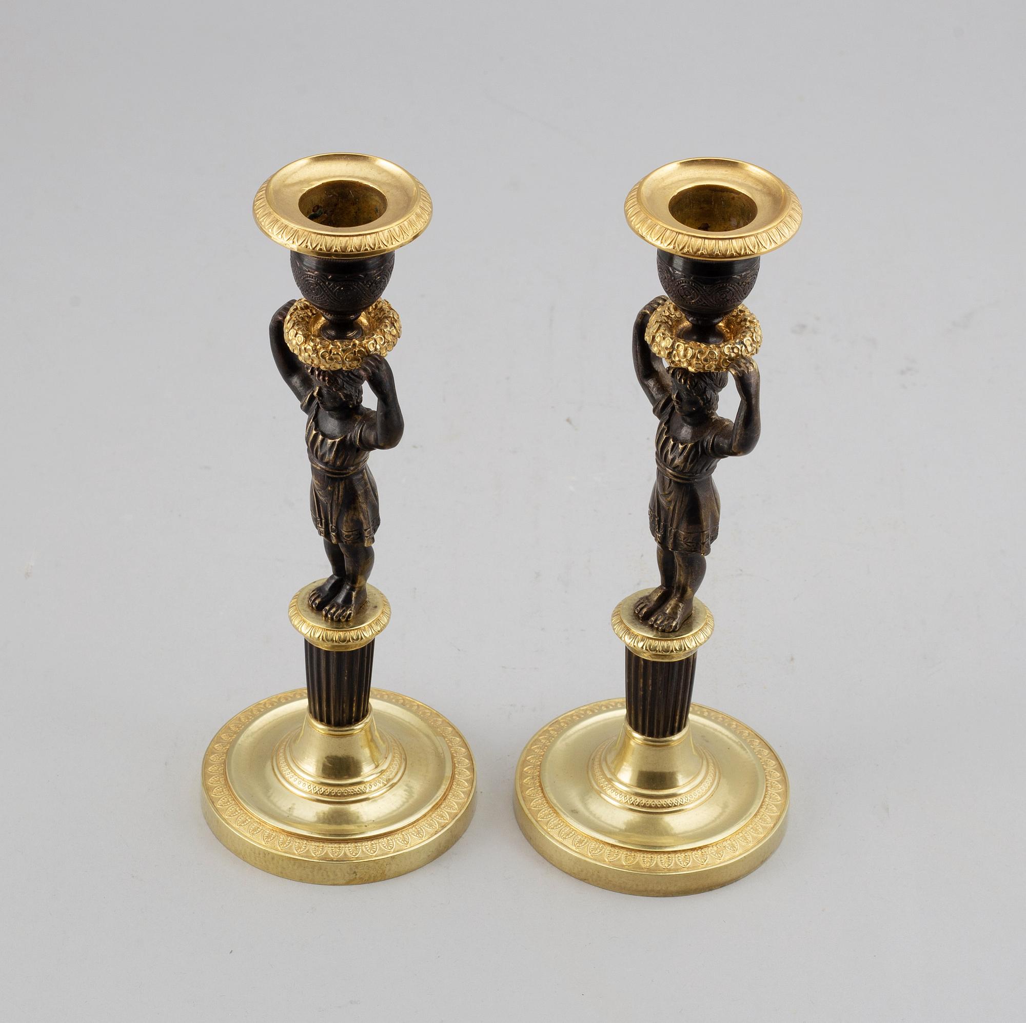 LJUSSTAKAR, ett par, förgylld och patinerad brons, senempire, 1800-talets mitt.