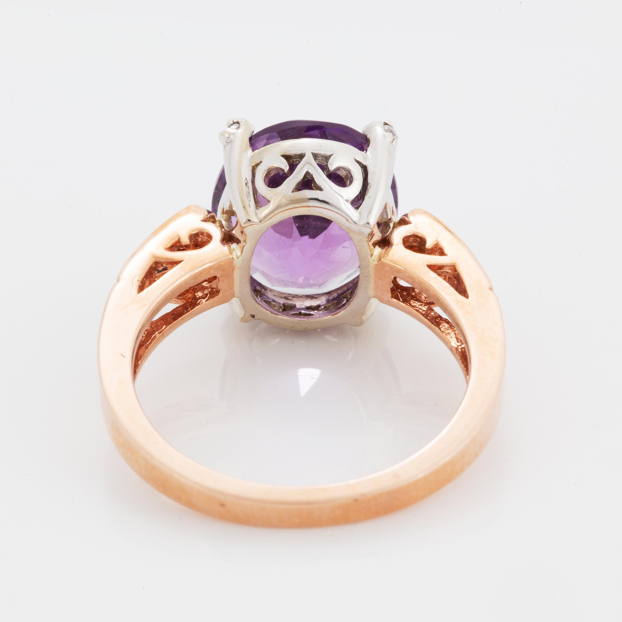 Oval faceted amethyst and brilliant-cut diamond ring.