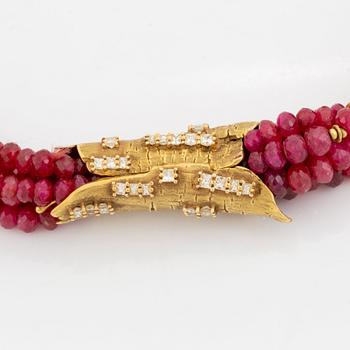 A W Nussberger ruby necklace with an 18K gold clasp set with princess-cut diamonds.