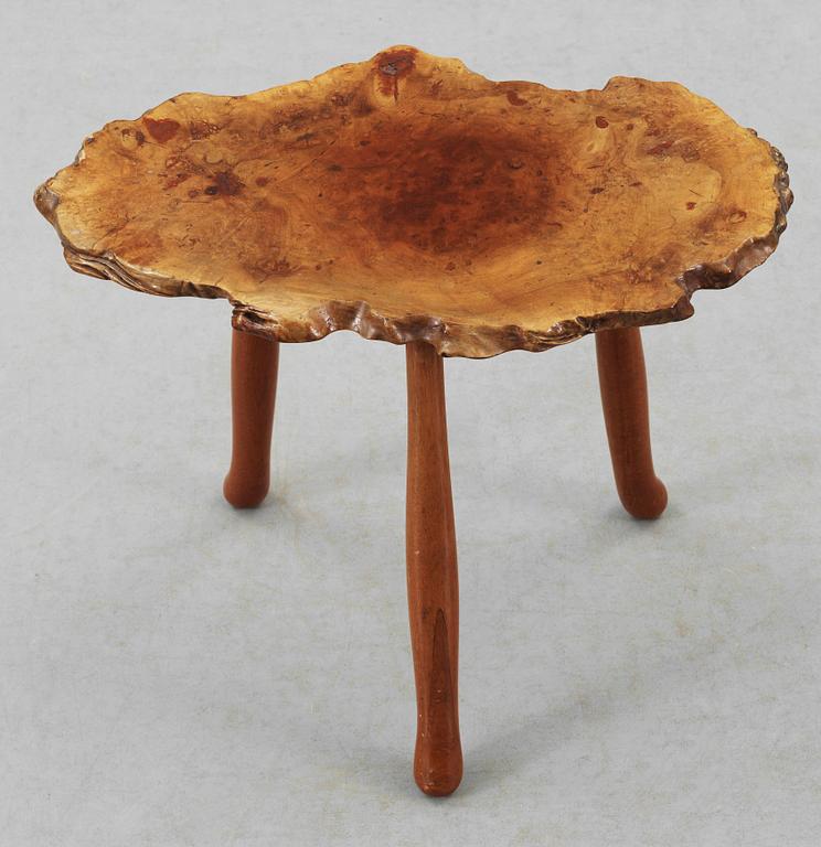 A Josef Frank elmroot and mahogany table by Svenskt Tenn.