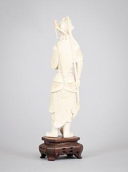 A carved ivory figure of a soldier in arms, late Qing dynasty, circa 1900.