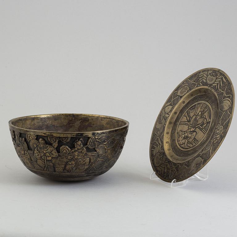 A Chinese brass bowl and Japanese dish, 20th century.