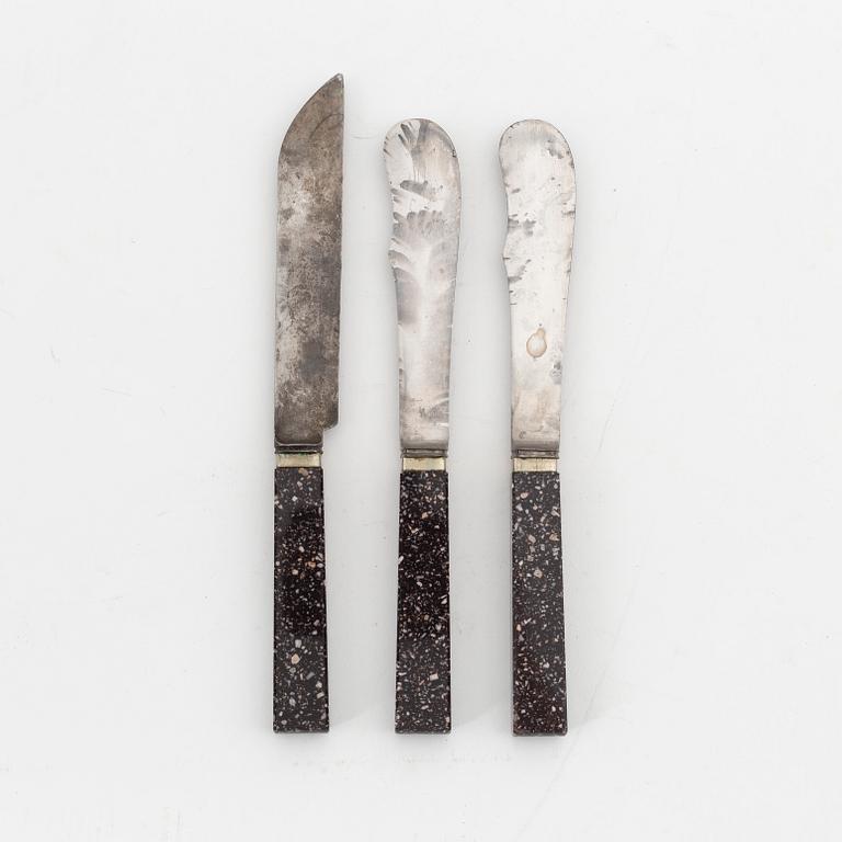 Three porphyry and steel knives, circa 1900.