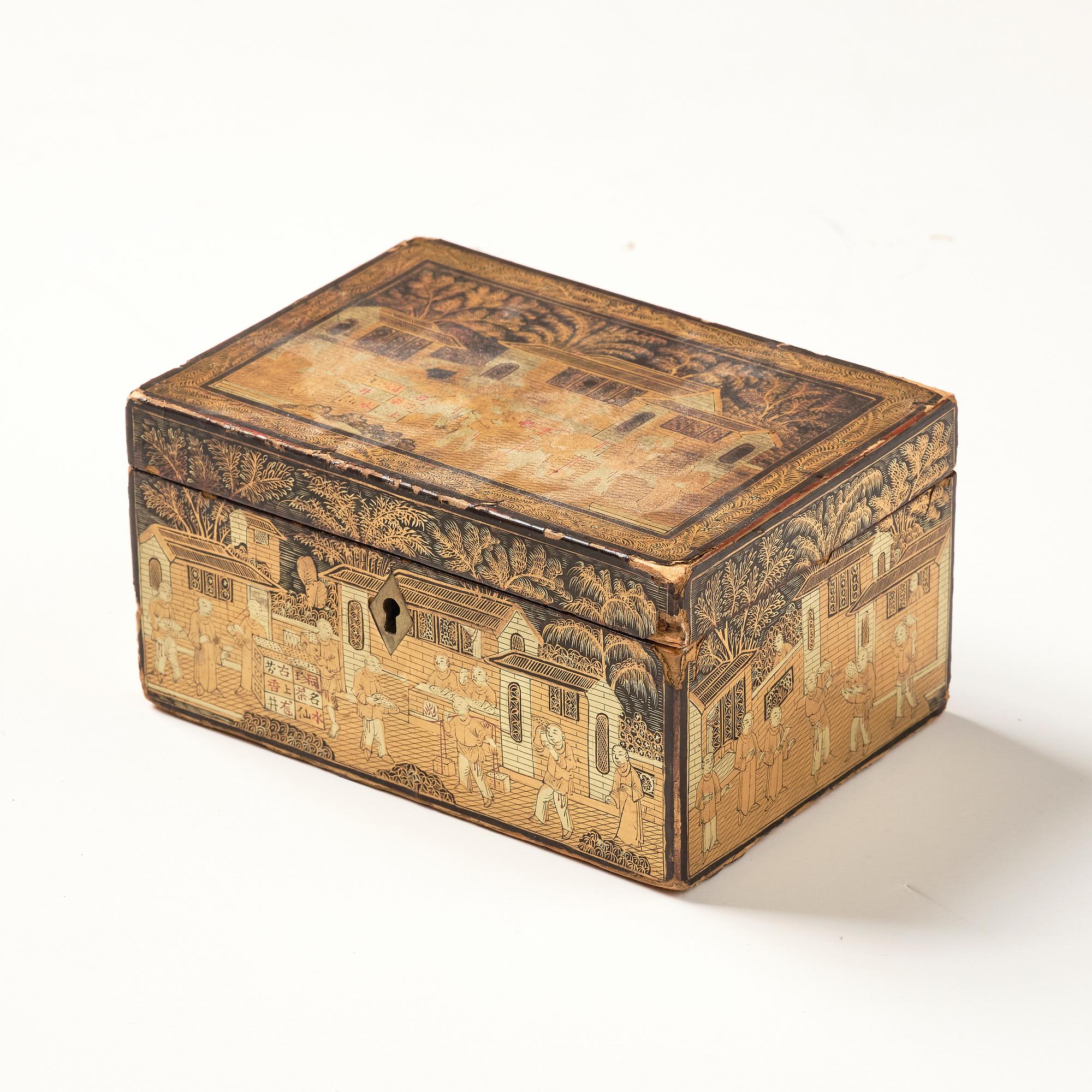 A lacquer tea box and a blanc de chine cup, Qing dynasty 18/19th century.