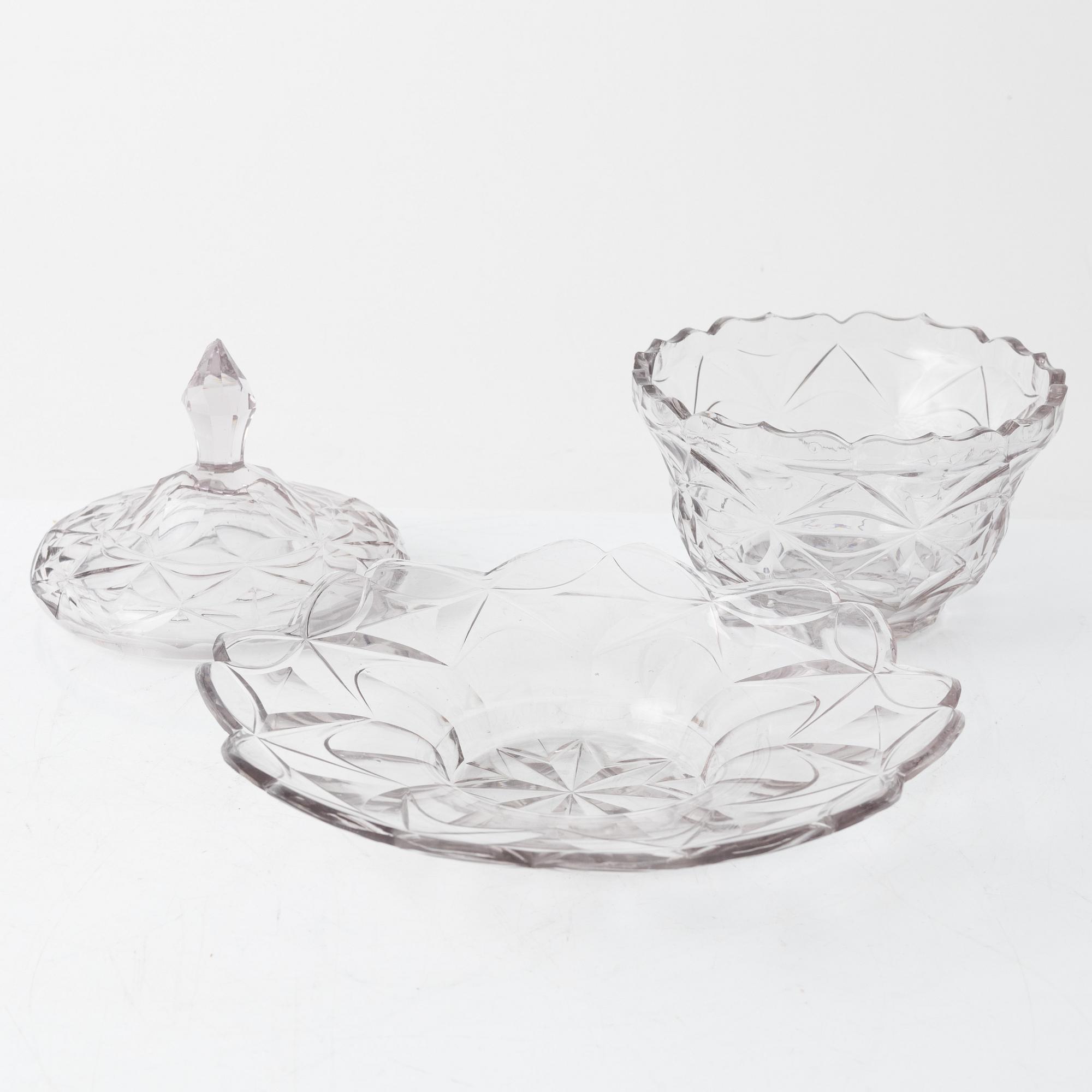 A pair of lidded glass bowls with stands, late 19th century.