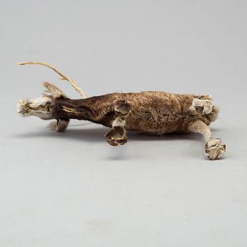 A Sami reindeer fur figure of a reindeer.