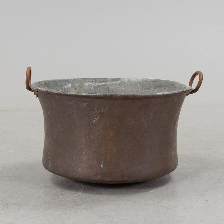 A 19th century copper cauldron.