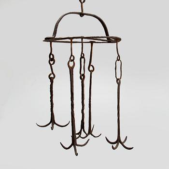 A wrought iron meat hanger 18/19th century.