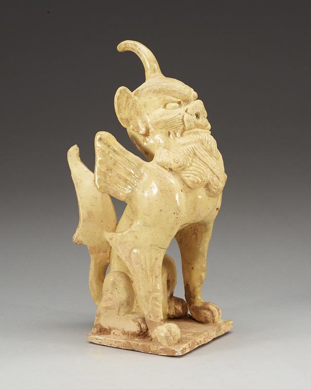 A yellow glazed pottery guardian, Tang dynasty (618-907).