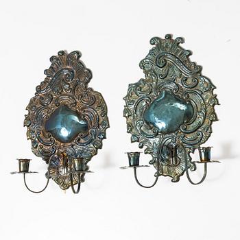 A pair of Rococo-style silver-plate sconces, early 20th century.