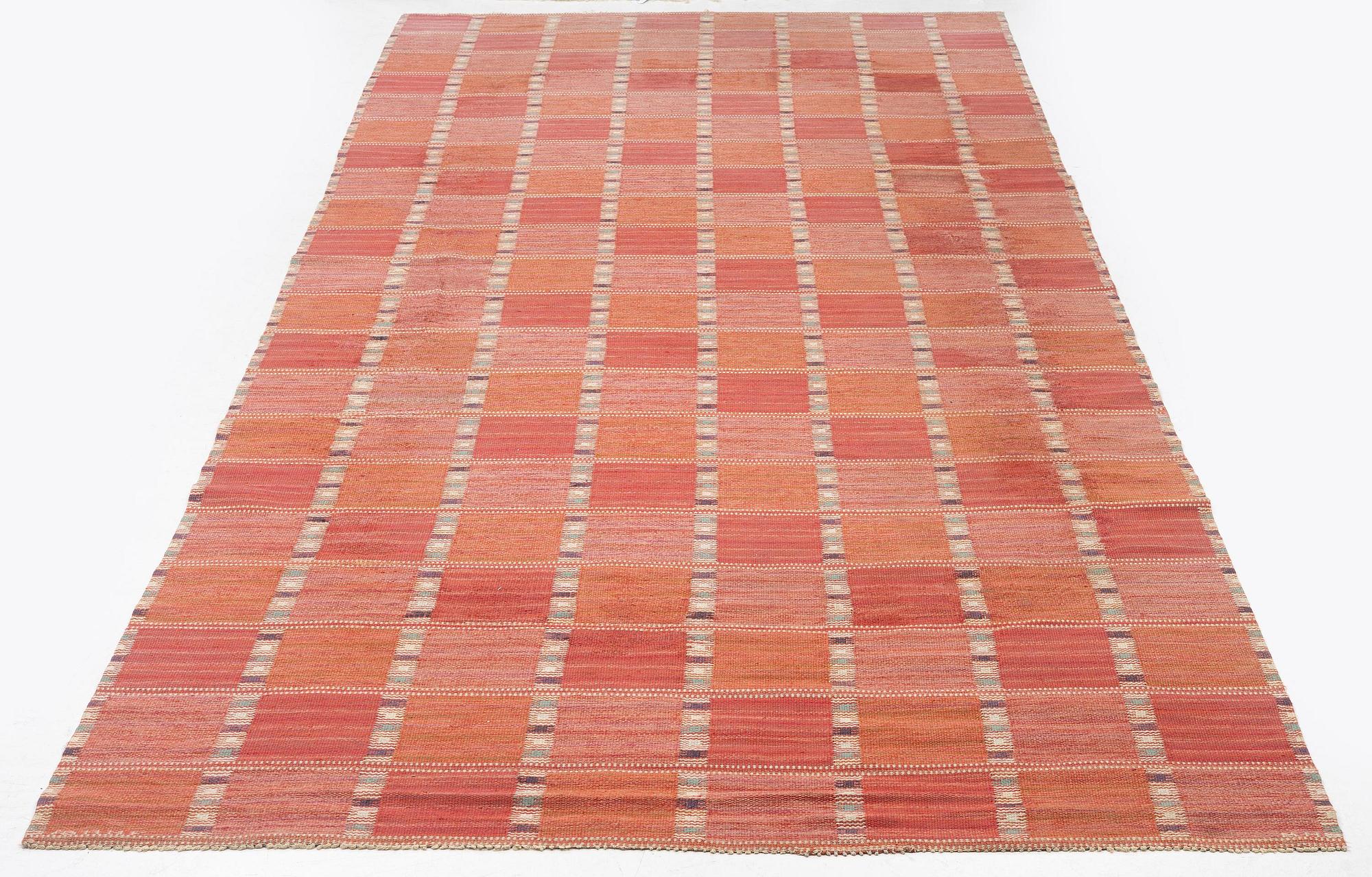 Barbro Nilsson, a carpet, 'Falurutan, röd Borås', flat weave, c. 502 x 212 cm, signed AB MMF BN.