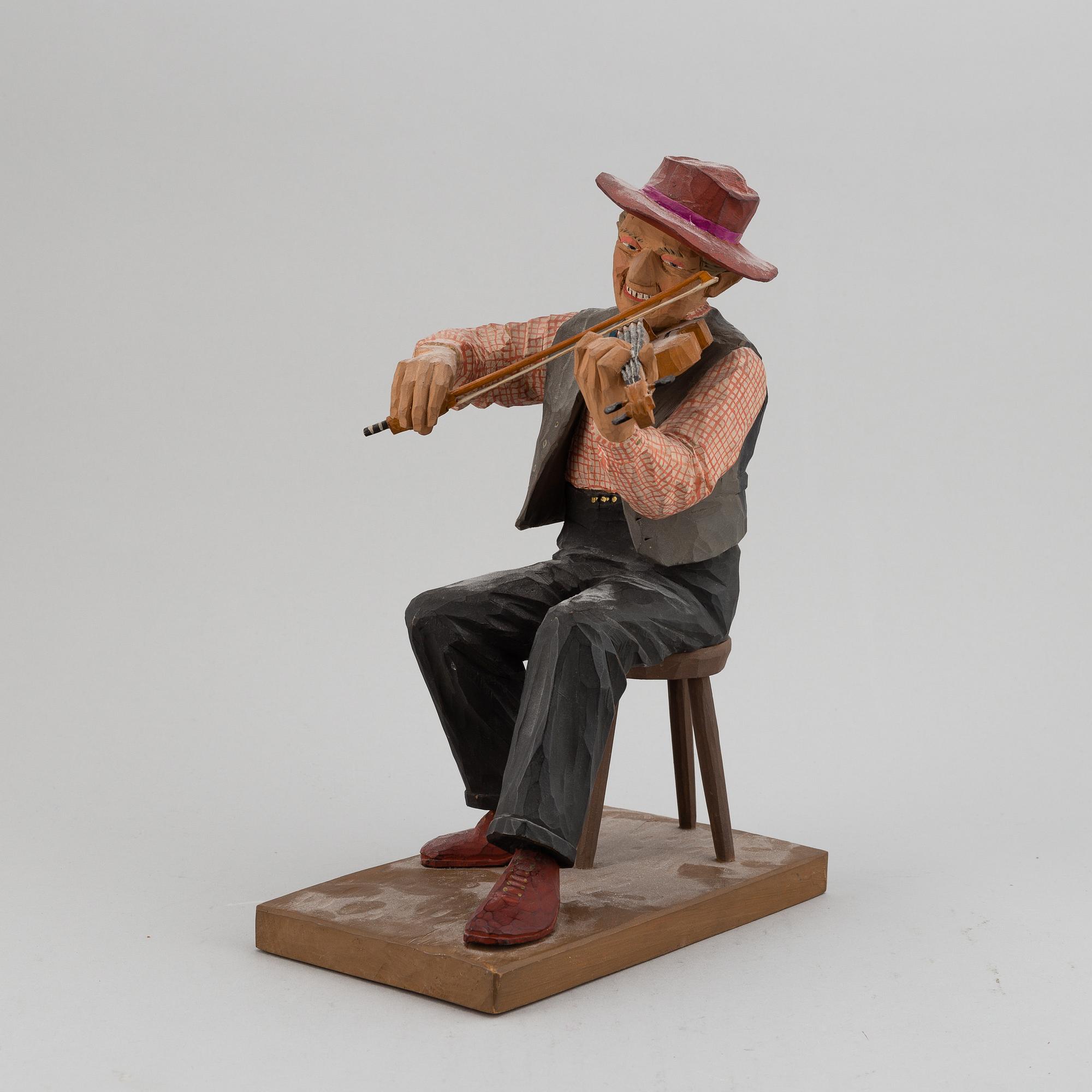 HERMAN ROSELL, a painted wooden sculpture.
