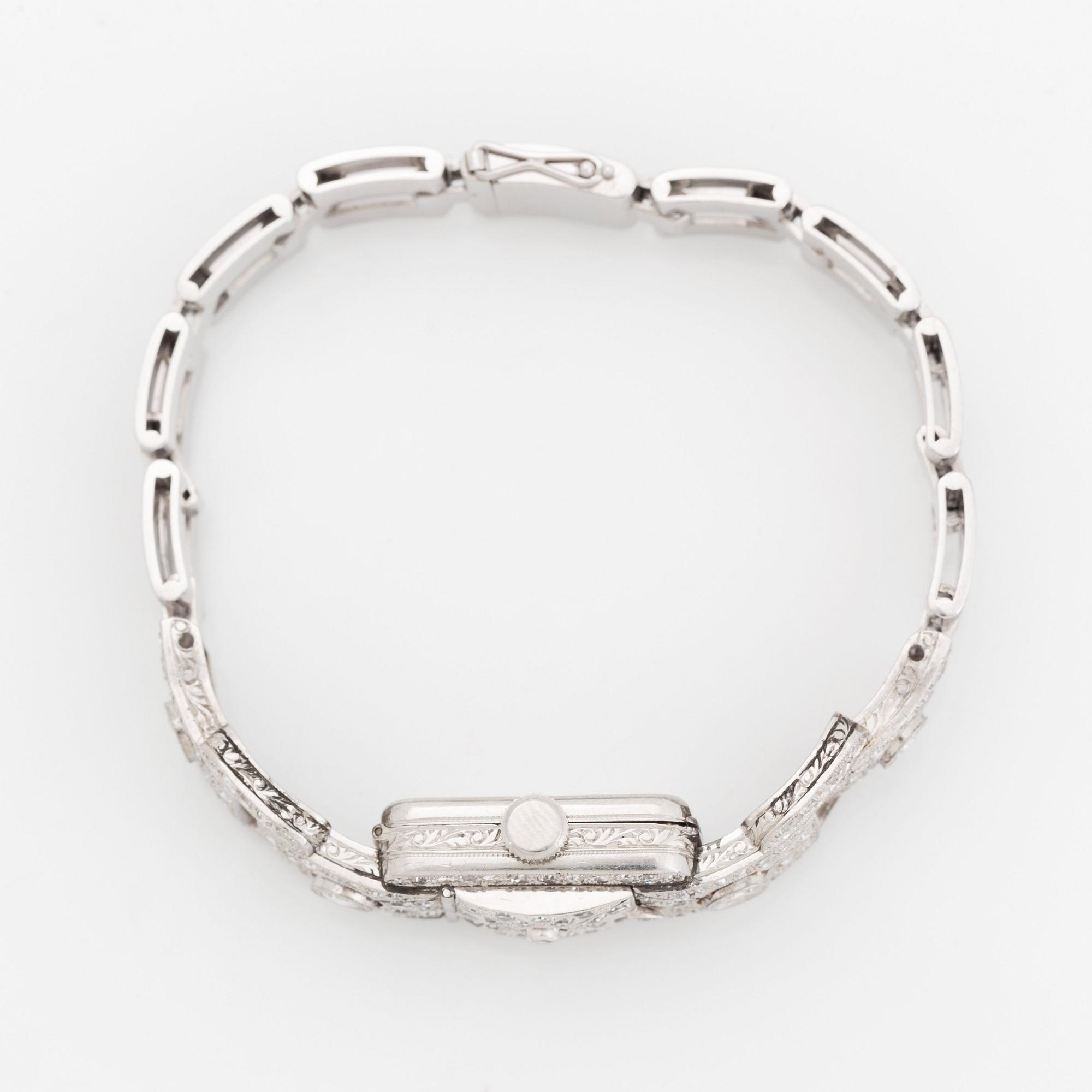 A bracelet/watch in platinum and 18K white gold set with old- and eight-cut diamonds.