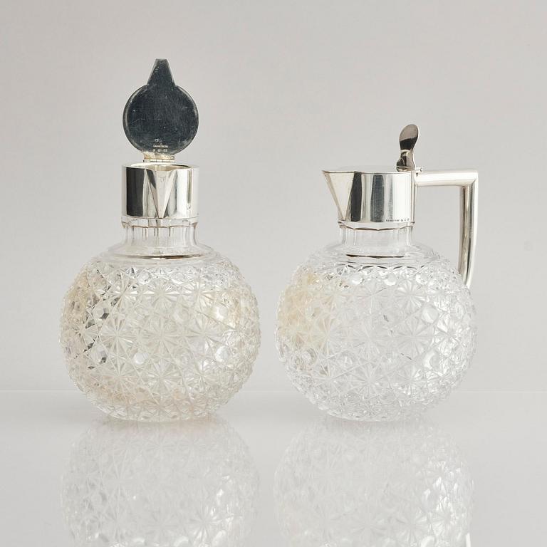 A Swedish pair of silver and cut-glass decanters, mark of C.G. Hallberg, Stockholm 1893.