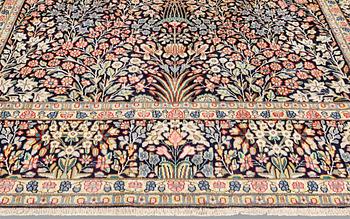 A 'Millefleur' Kerman Laver carpet, c. 410 x 290 cm.