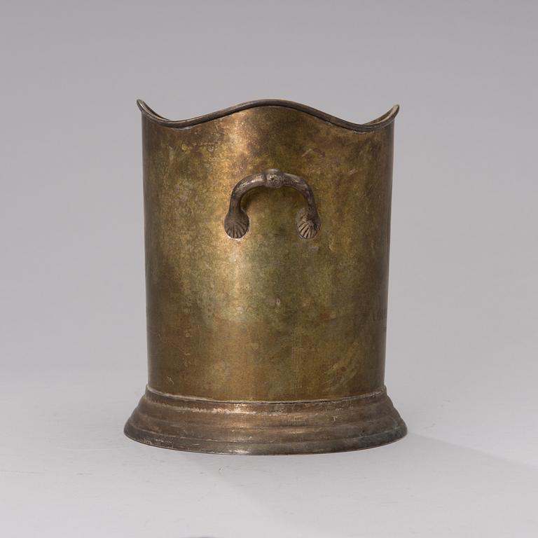 A Louis Roederer champagne cooler of silver plated brass.