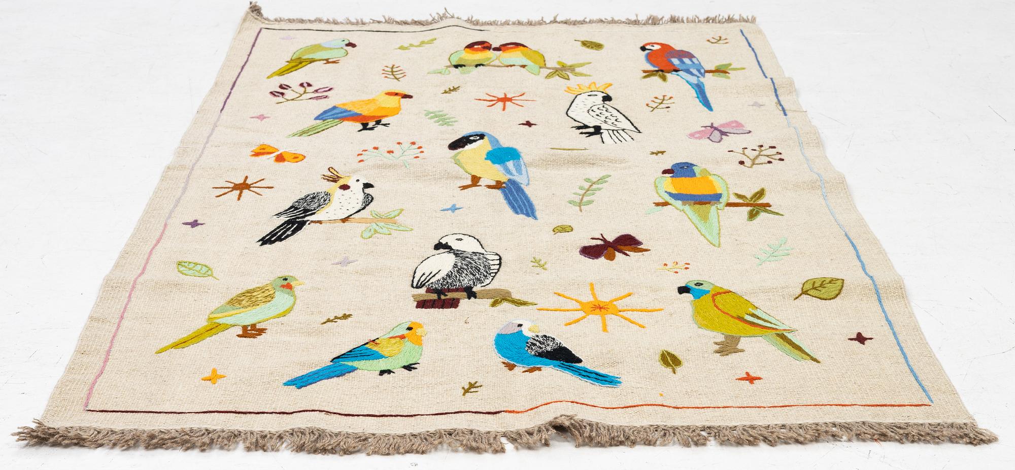 A hand-embroidered Kelim rug, 180 x 118 cm.