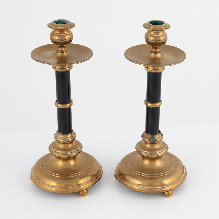 A pair of Skultuna brass and wood candlesticks, first part of the 20th century.