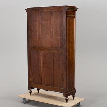 A Russian mahogany veneered display cabinet from around year 1900.