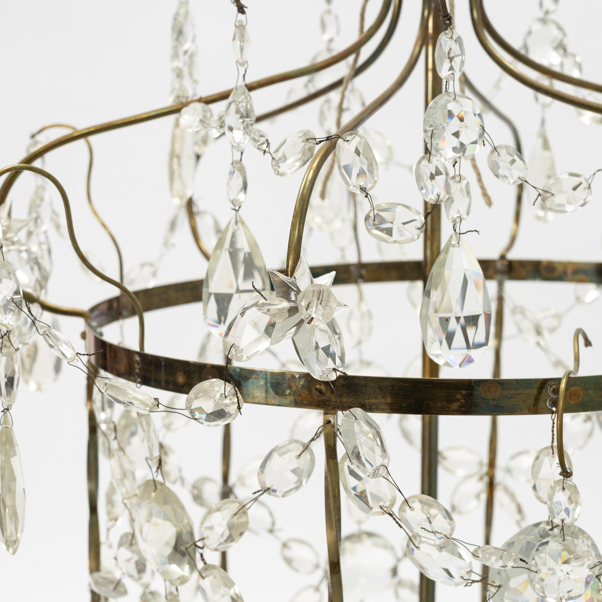 A three-light Gustavian-style hanging light, circa 1900.