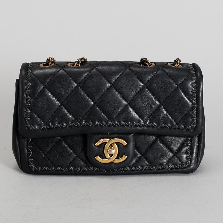 CHANEL, a black quilted fabric 'Flap Bag', 2015-2016.