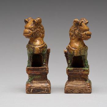 A pair of green and yellow glazed joss stick holders, Ming dynasty (1368-1644).