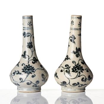 A pair of blue and white lotus vases/water sprinklers, Ming dynasty (1368-1644).